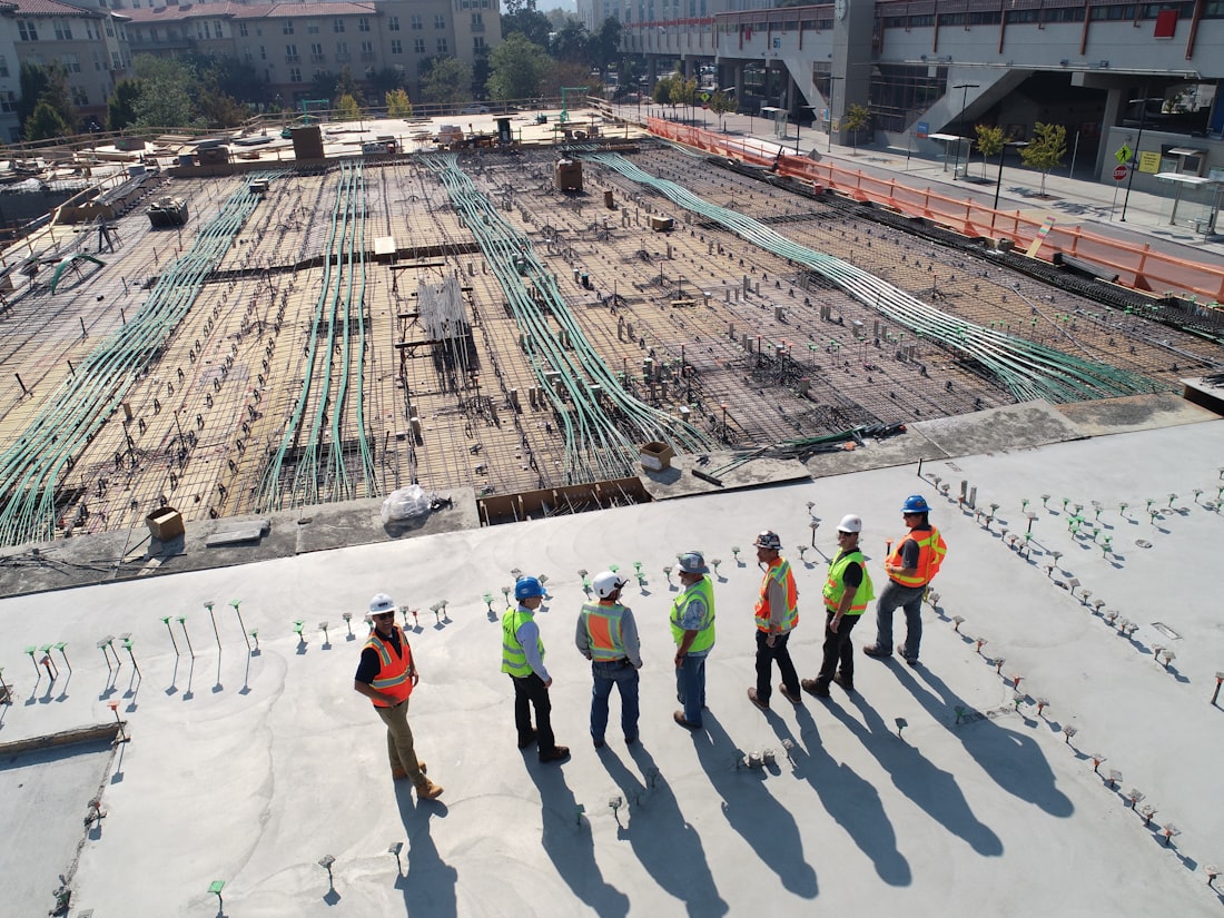 The Fiber Factory crew reviewing plans on an active construction site